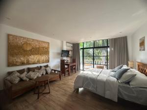 Ένα ή περισσότερα κρεβάτια σε δωμάτιο στο Casbah De Oro Guest and Transient House