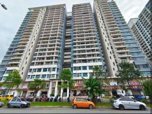 two tall buildings with cars parked in front of them at The Garden 2Bed Cozy Vibrant Family Retreat BySTAY in Skudai