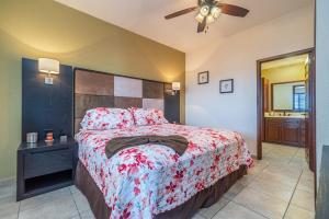 a bedroom with a bed and a ceiling fan at Viva Beach Life Comfortable Oceanfront in Puerto Peñasco