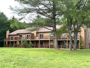 a large house with a large yard in front of it at LINCOLN WHITE MOUNTAIN RETREAT - Loon Mnt, King bed, Monthly Rental in Lincoln