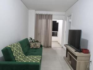 Televisyen dan/atau pusat hiburan di Captiva Beach - 400m da PRAIA - WiFi - Vaga Coberta
