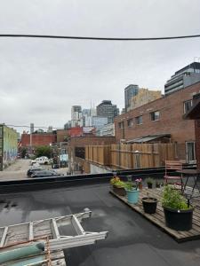 a view of a city from the roof of a building at Private Balcony Studio Apartment for 5 People at Queen Street Downtown in Toronto