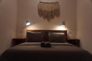 Postel nebo postele na pokoji v ubytování Tipsea Turtle Rooftop Hostel Gili Trawangan