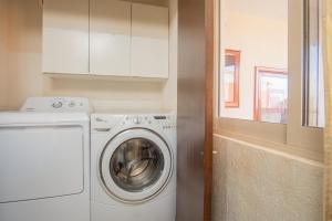 a white washer and dryer in a small kitchen at Sonoran Sky in Puerto Peñasco