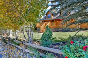 a wooden house with a fence in front of it at Knotty and nice #177 in Big Bear Lake