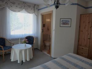 Postel nebo postele na pokoji v ubytování Pension Rheingold Garni