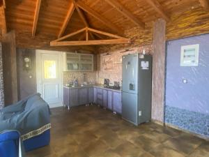 a kitchen with a refrigerator in a room at Stefania's house in Agia Effimia