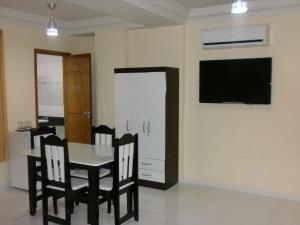 TV a/nebo společenská místnost v ubytování Hotel Columbia