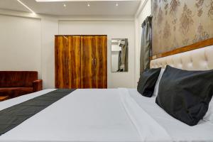 Postel nebo postele na pokoji v ubytování Hotel O KP Pride