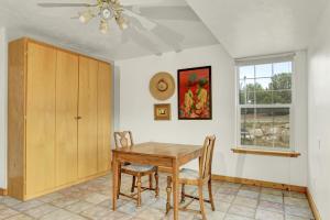 a dining room with a table and chairs and a window at Ranchette Ponderosa - The Freemont #2 at Wind Walker Homestead in Spring City