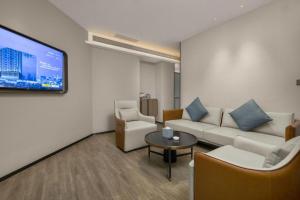 TV a/nebo společenská místnost v ubytování Echarm Hotel Changsha Huanghua Airport + 229 fotografií