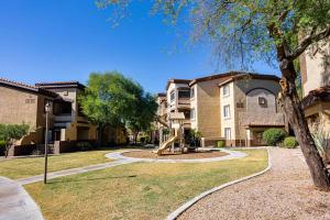 a park with a playground in front of a building at Southern #2068 Mesa in Mesa