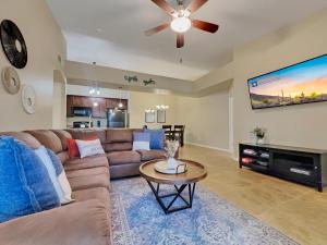 a living room with a couch and a ceiling fan at Southern #3116 Mesa in Mesa