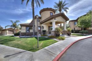 a house with palm trees in front of a street at Southern #3116 Mesa in Mesa