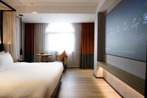 Postel nebo postele na pokoji v ubytování Paco Hotel Datang Metro Guangzhou-Close to Pazhou Exhibition Hall and free breakfast