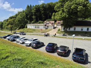 a group of cars parked in a parking lot at Thise Ladegaard in Manna