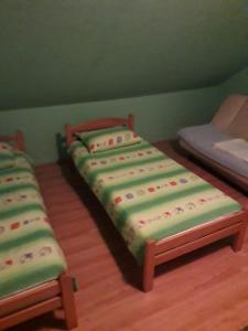 Postel nebo postele na pokoji v ubytování VILA NATALIJA APARTMANI