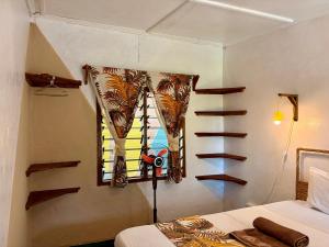 Letto o letti in una camera di Hera Hostel Diani