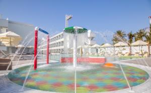 a water fountain in the middle of a pool at Nicholas Color Hotel in Ayia Napa