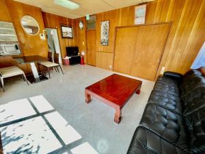 a living room with a couch and a coffee table at Hannan Village fourth in Hannan