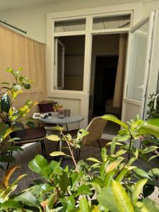 a room with a table and chairs and a window at Guesthouse Marina in Tučepi