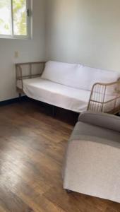 a bed sitting in a room with ainylinylinylinylinylinylinylinyl at Bay Front Eco-Cottage in Corozal