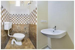a bathroom with a toilet and a sink at Super Townhouse Hitech City Madhapur in Hyderabad