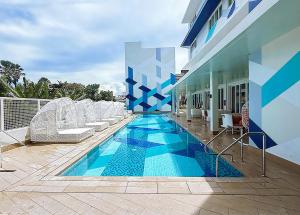 a swimming pool in the middle of a building at Stellar Panglao in Panglao Island