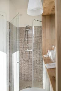 a bathroom with a shower with a glass door at B&B Bucci 54 in Morciano di Romagna +22 photos