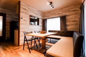 a dining room with a table and chairs at Funabashi-honcho Detached house in Funabashi
