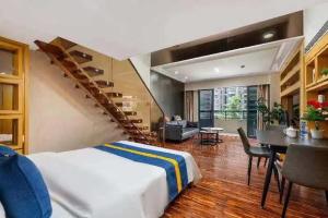 Giường trong phòng chung tại Guangzhou Bulgari International Service Apartment (Zhujiang New Town Canton Tower Branch)