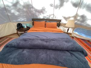 a bedroom with a bed in a tent at Tree Top Sanctuary Cowichan Valley in Duncan