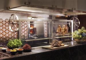 a kitchen with chickens and other food on display at Hyatt Regency Istanbul Atakoy in Istanbul