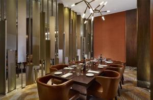 a dining room with a long table and chairs at Hyatt Regency Istanbul Atakoy in Istanbul