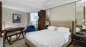 a hotel room with a bed and a desk at Hyatt Regency Istanbul Atakoy in Istanbul