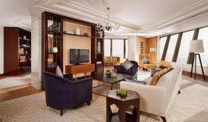 a living room filled with furniture and a tv at Hyatt Regency Istanbul Atakoy in Istanbul