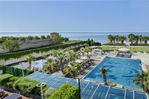 an aerial view of a resort with a pool and the ocean at Hyatt Regency Istanbul Atakoy in Istanbul