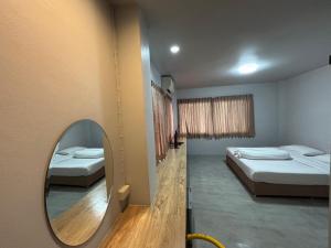 Postel nebo postele na pokoji v ubytování Lithai Guesthouse