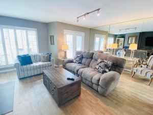 a living room with a couch and a coffee table at Wilmington avenue 50 #316 in Rehoboth Beach