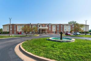 a roundabout in the middle of a street with a building at Comfort Inn & Suites Chesterfield - St Louis in Chesterfield