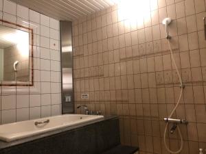 Baðherbergi á ホテルハンズ