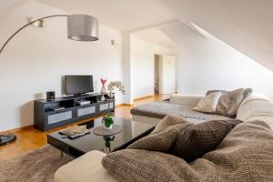 Et tv og/eller underholdning på Bel appartement centre climatisé parking privé