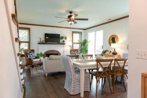 a dining room and living room with a table and chairs at 18 Veranda Beach Drive in Fripp Island