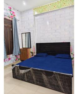 Ένα ή περισσότερα κρεβάτια σε δωμάτιο στο Gauri Shankar P Guest house