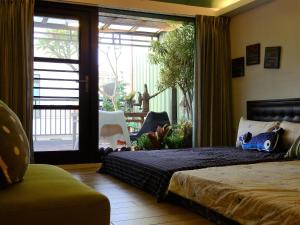 Ένα ή περισσότερα κρεβάτια σε δωμάτιο στο Anping House