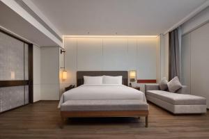 Katil atau katil-katil dalam bilik di Maison New Century Tongxiang