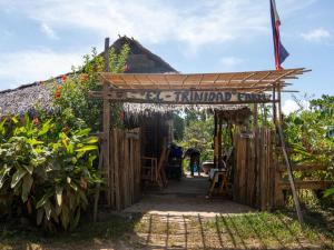 a kiosk with a sign that reads immortal farm at El Trinidad Organic Farm in El Nido +35 photos