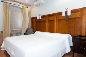 Ein Bett oder Betten in einem Zimmer der Unterkunft Hotel Restaurante Setos