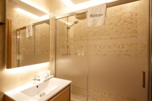 a bathroom with a shower and a sink at Plaza Obradoiro Express by Bossh! Hotels in Santiago de Compostela