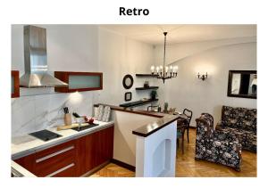 a kitchen and a living room with a table at Home & Travel Apartments - AC - Parking - City Centre - Manufaktura - OFF Piotrkowska - EC1 - ATLAS Arena - Orientarium - Monopolis in Łódź +98 photos
